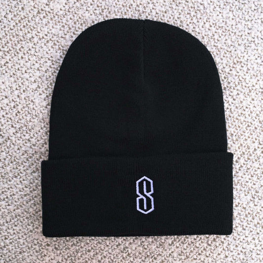 May include: Black knit beanie with a white embroidered letter 'S' on the front.